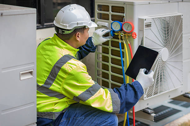Professional Heat Pump Repair technician working in Oak Ridge, NC